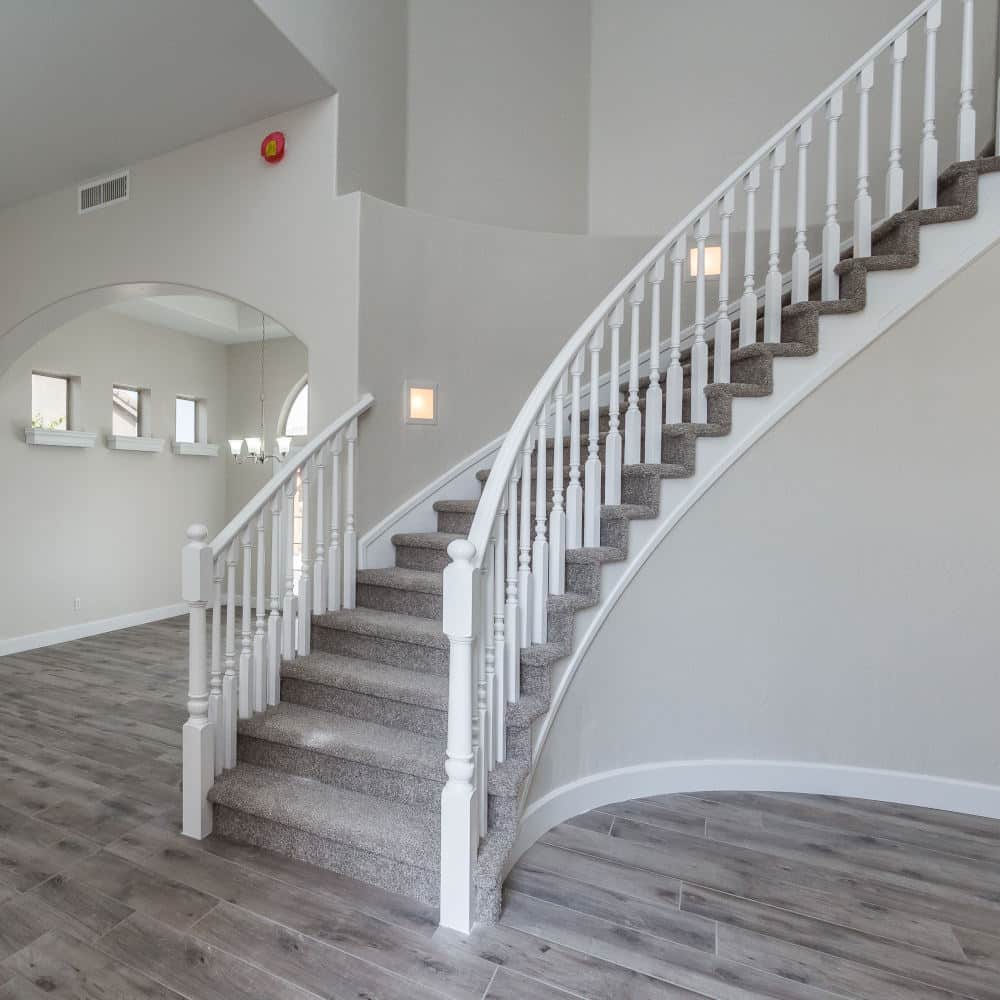 A freshly painted interior room with a staircase.