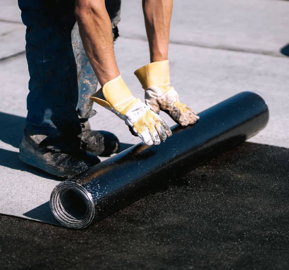 Contractors working on a flat roof